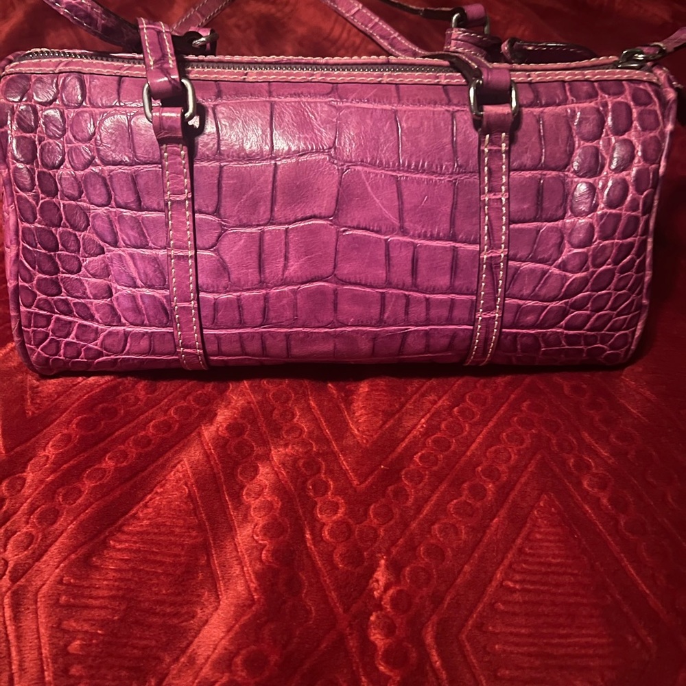 Leather croc print fuchsia handbag. Dooney and Burke brand.